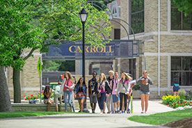 Students walking on campus. Link to Gifts of Real Estate Students walking on campus. Link to Gifts of Real Estate
