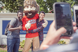 Students posing with mascot. Link to Gifts of Life Insurance Students posing with mascot. Link to Gifts of Life Insurance